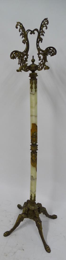 Brass and Onyx Coat Rack: Fancy brass and onyx coat rack that has brass feet with maidens heads and claw feet