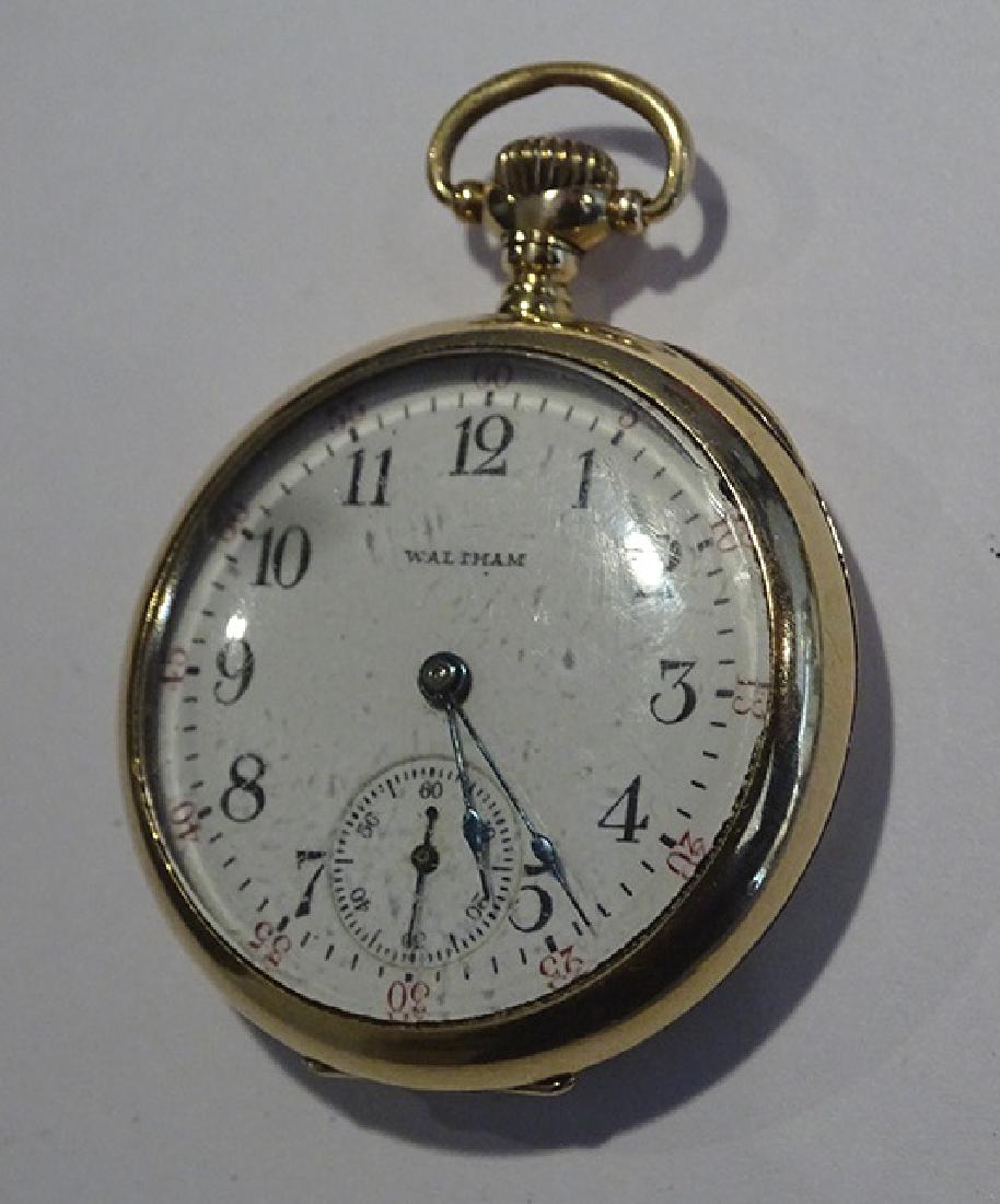14k Gold Pocket Watch: Small ladies Waltham 14k gold open face watch. Monogramed. 1¾" top to bottom. 28 grams total weight. Estate fresh. *We will only accept cash, check wire transfer, and certified Live Auctioneer credit