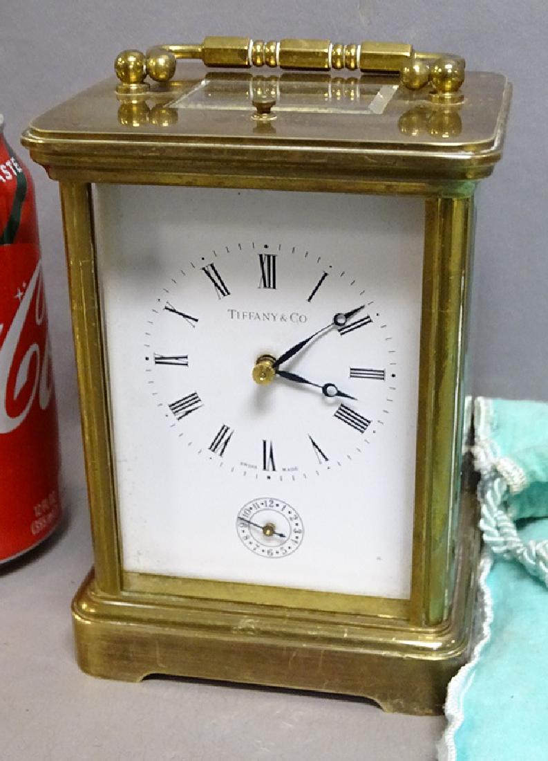 Signed Tiffany Repeater Carriage Clock: Signed Tiffany repeater carriage clock. Missing 2 glasses with bag. Not working. 11 jewels. Swiss made Mathew Norman 1751. 4" wide, 6" tall.