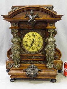 Oak Ansonia Senator Clock: Monumental oak Ansonia senator with lions, standing figures, and angels. In working condition.