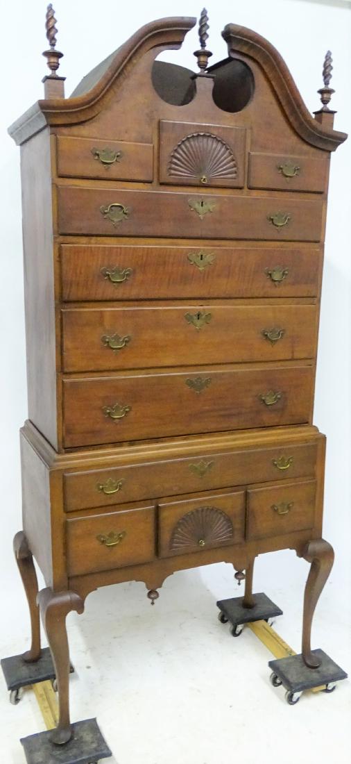 Period 2 Piece Cherry Fan Carved Highboy: Period 2 piece cherry fan carved highboy with heavily figured molding on top with flame finials. Some work done to the base. 85" tall, 37" wide, 18" deep.
