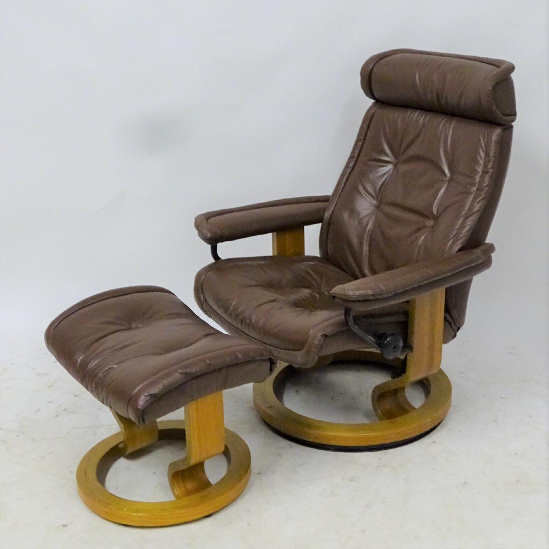 Leather Recliner and Ottoman by Ekornes Norway: Leather recliner and ottoman with adjustable back. In brown leather by Ekornes of Norway. In beautiful condition.
