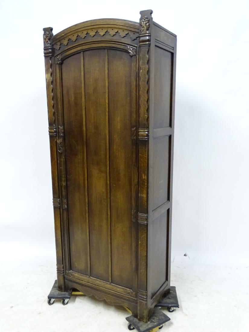 Narrow Oak Wardrobe: Nice narrow oak wardrobe with gothic look. 72" tall, 29" wide, 16" deep.
