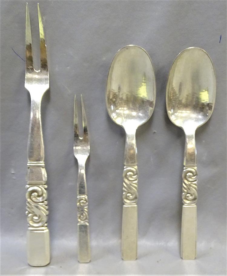 4 Piece Sterling George Jensen: 4 pieces of George Jensen sterling in scroll pattern including (2) large 8" serving spoons, (1) 9" and (1) 6" forks. No monograms.