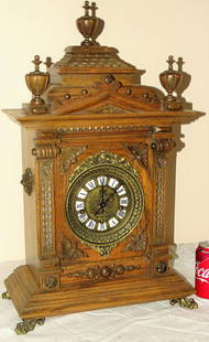 Lg Oak Gazo Bracket Clock: Lg oak Gazo bracket clock with Westminster chimes, fancy case, and brass claw feet. Springs all good. 25" tall, 15" wide, 7" deep.