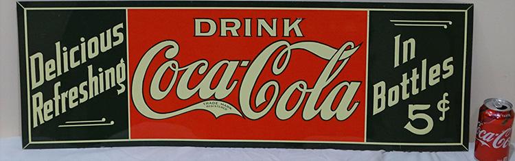 5 Cent Tin Coca Cola Ad Sign: 5 cent Coca Cola ad sign. Never been unwrapped (new old stock). Minor rust on bottom edge. 12" tall, 35" wide.