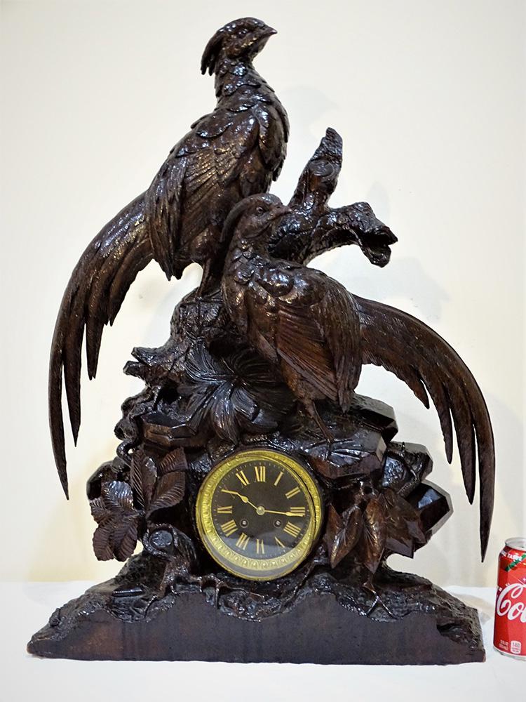 Antique 27" Black Forest Clock with Pheasant: Super antique walnut 27" black forest clock with 2 large pheasants. Nicely carved. 27 tall, 20" wide, 7" wide.