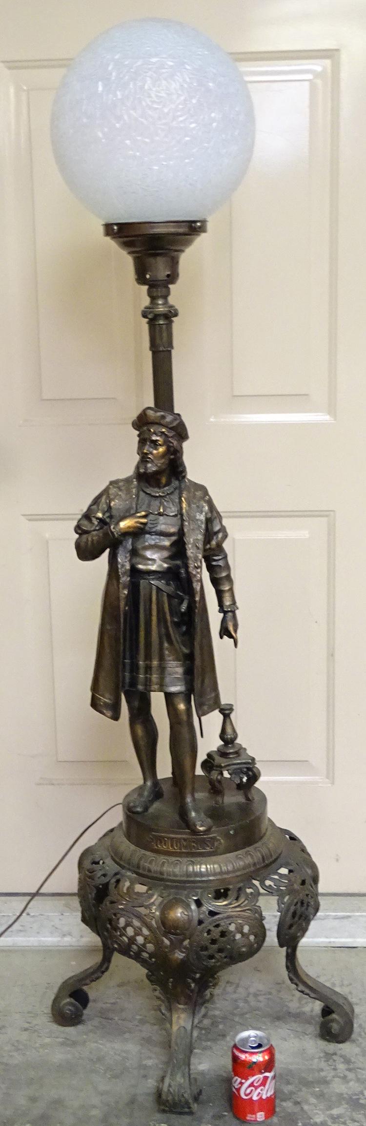 63" Figural Floor Lamp with Columbus: Nice 63" floor lamp with Columbus in original patina and a lg opalescent ball shade. 63" tall, 20" wide.