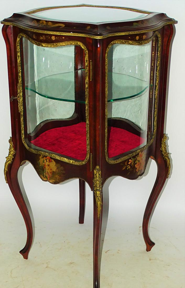 Fully Serpentine Glass Curio Cabinet: Pristine fully serpentine glass curio cabinet with painted scene all around. In original finish and bronze ormolu. 39" tall, 20" wide.