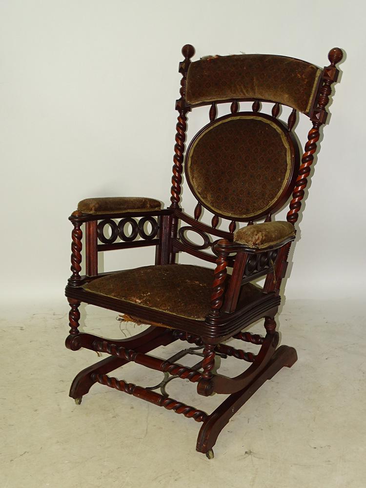Signed Hunzinger Rocker: Fancy signed Hunzinger rocker with barley twist posts, older upholstery. 42" tall, 27" wide, 29" deep.