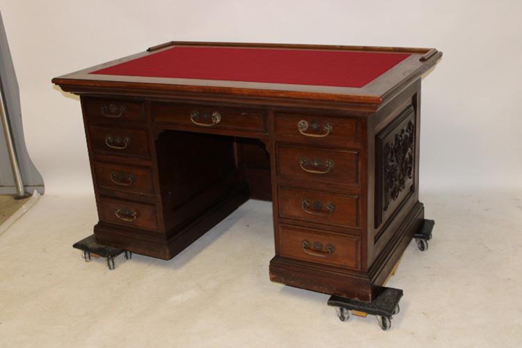 Fabulous Walnut Executives Desk: Fabulous 54" walnut executive desk. Carved all around, felt top, original finish and hardware carved panels on 2 sides.