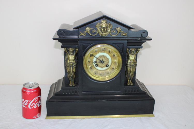 Exceptional Marble and Bronze Clock: Exceptional marble and bronze clock marked J. Perry, Paris with French movement and standing bronze men. Springs all good. 16" wide, 14" tall, 6" deep.