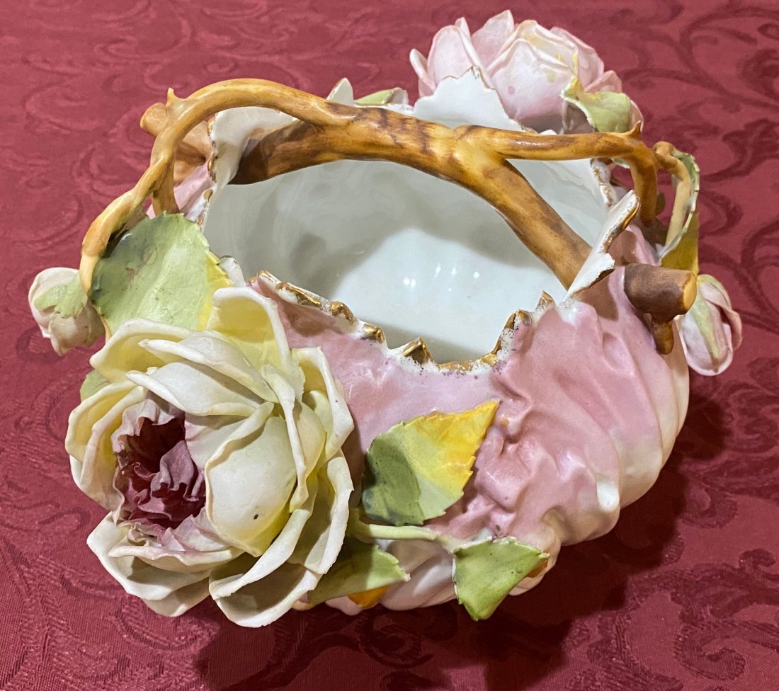 R.W. Rudolstadt Vase: Signed R.W. Rudolstadt vase with 3 dimensional roses.Very beautiful. Looks all good. Might be a minor rough edge that I missed. 10" wide, 6" tall, 8" deep.
