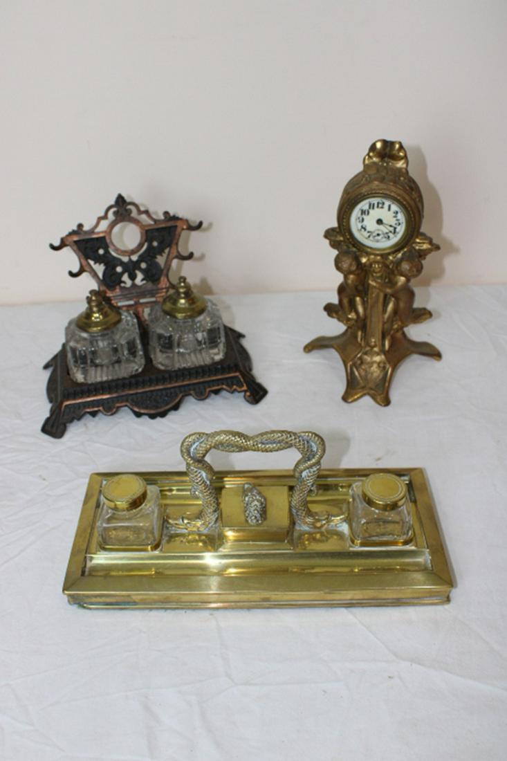 2 Victorian Inkwells and Clock: 2 Victorian inkwells. (1) with dolphins. Clock with cupids.
