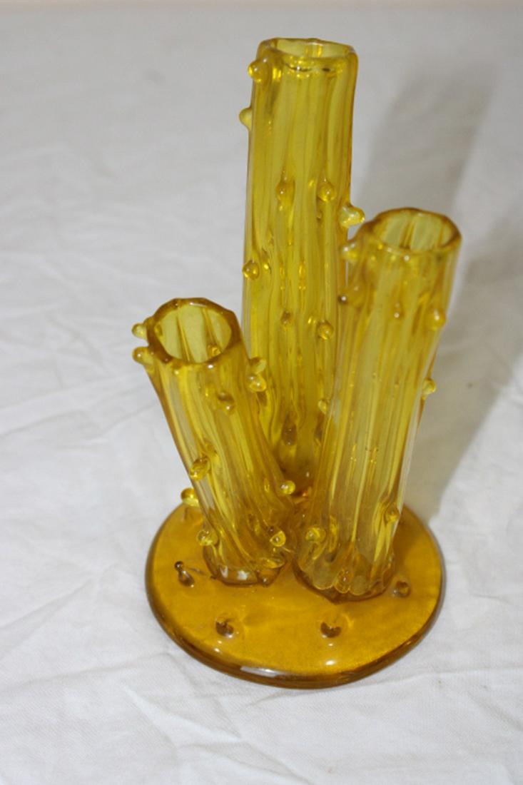 Signed Steuben Tree Trunk Vase: Signed Steuben tree trunk vase in an amber color. No chips or cracks.