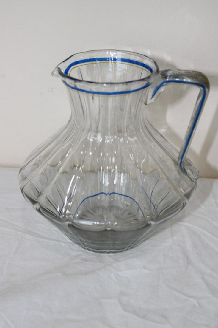 Signed Dawn Nancy Pitcher: Signed Daum Nancy France pitcher with blue and yellow stripping. Perfect. 6" wide, 7" tall.