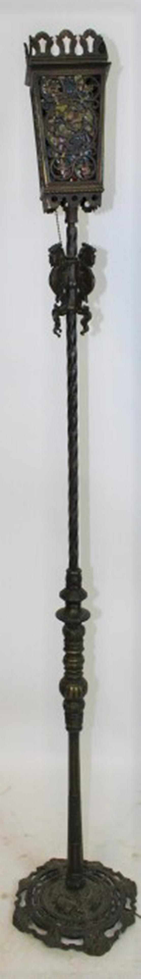 Oscar Bach Style Floor Lamp: Oscar Bach style floor lamp with mythological figures. Has leaded looking plastic inside, some chipping off. 66" tall.