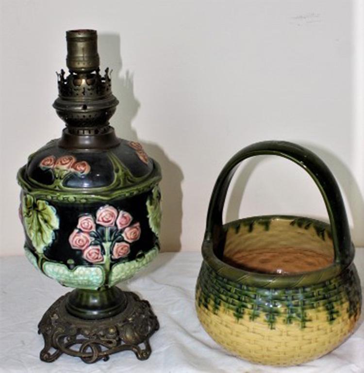 2 Pieces of Majolica Including Oil Lamp: 2 pieces of Majolica including nice oil lamp. Piece missing on foot (see photo). Majolica basket.