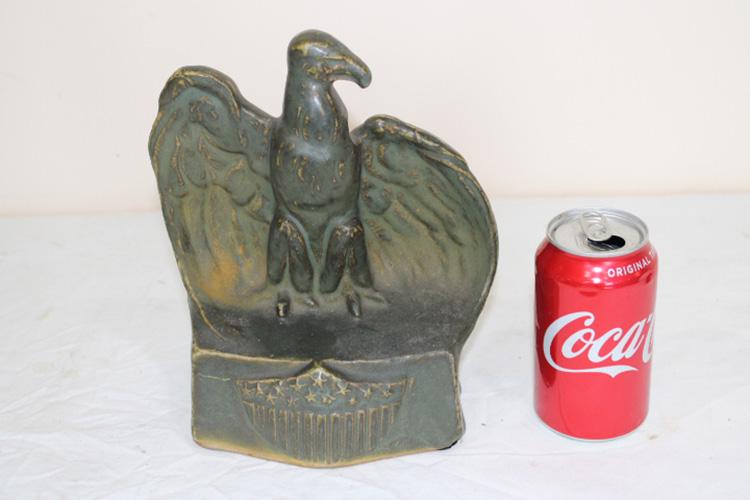 9" Fulper Pottery Eagle: 9" Fulper pottery eagle with flag and stars on front in matte green. No chips or cracks. 7" wide, 9" tall, 5" deep.