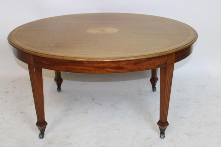 Inlaid Margolis Coffee Table: Inlaid Margolis coffee table with brass rollers. 36" wide, 18" tall, 28" deep.