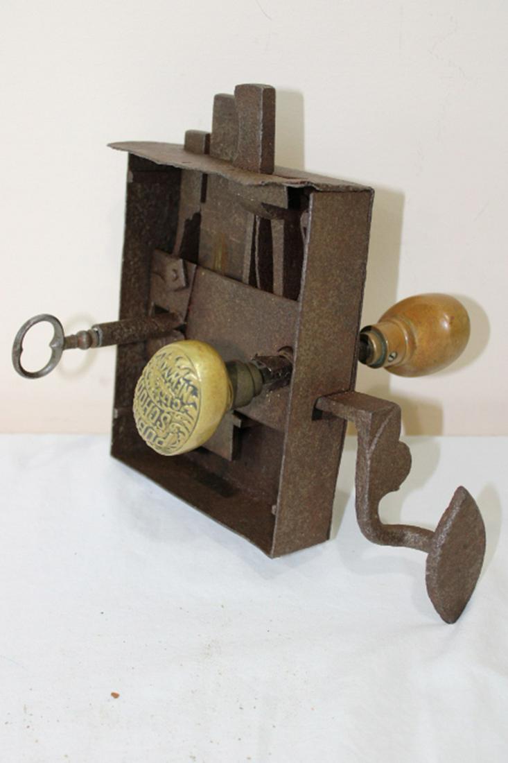 Early NYC Public School Door Lock: Early NYC public school door lock with key (work hard) with double brass knobs. 9" wide, 9" tall, 7" deep.