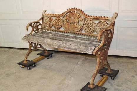 Cast Iron Bench with Pointer and Birds: Cast iron bench with pointer on the back , bird arms and floral medallions. No cracks or breaks. Pittsfield estate. 50" wide, 32" tall, 20" deep.