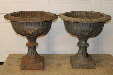 Pair of Victorian Cast Iron Urns: Pair of Victorian cast iron urns with damage (see photos). 20" wide, 22" tall.