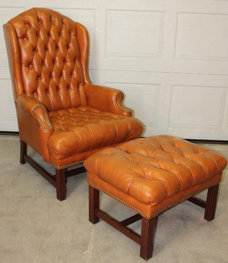 Quality Leather Tufted Wingback and Stool: Quality leather tufted wingback with matching stool. In excellent condition. Chair is 29" wide, 44" tall, 33" deep.