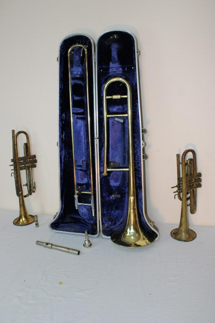 Trombone and 2 Trumpets: Large trombone in case in nice condition and (2) trumpets in as found condition, (1) York.