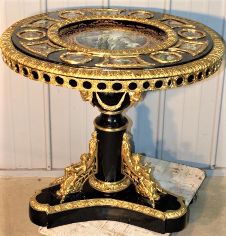Fabulous Decorator Bronze Ormolu Table with Scenic: Fabulous decorator table with bronze ormolu and porcelain plaques with bronze cupids and rams heads. Not antique but high quality and pretty. 35" wide, 32" tall.