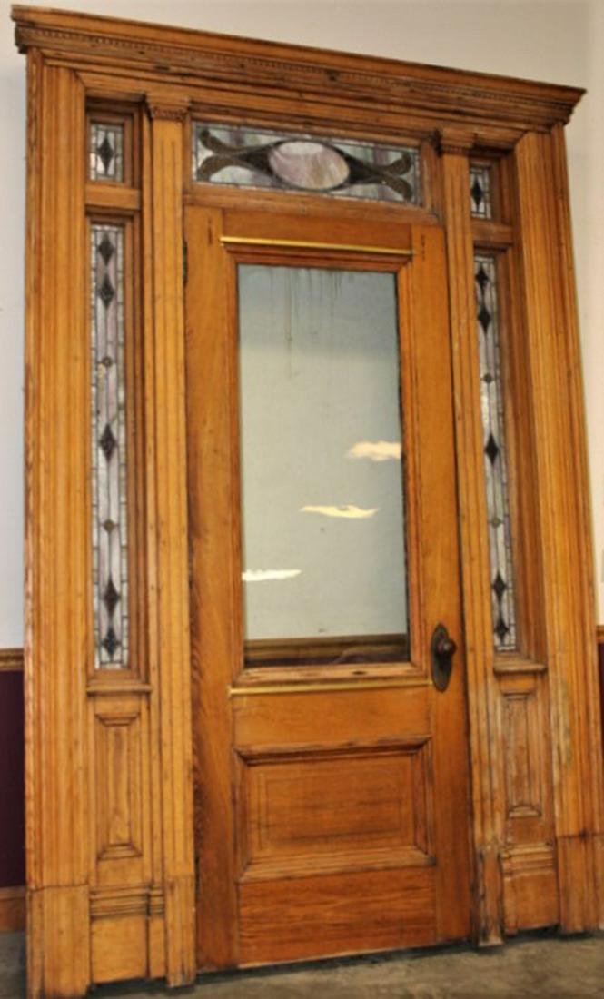 Great Oak Entrance Way with Leaded Windows: Great oak entrance way with leaded windows, columns and raised panels. Needs 3 pins for the door. 1 side stripped, the other side original leaded panels with jewels. A couple of minor cracks, original