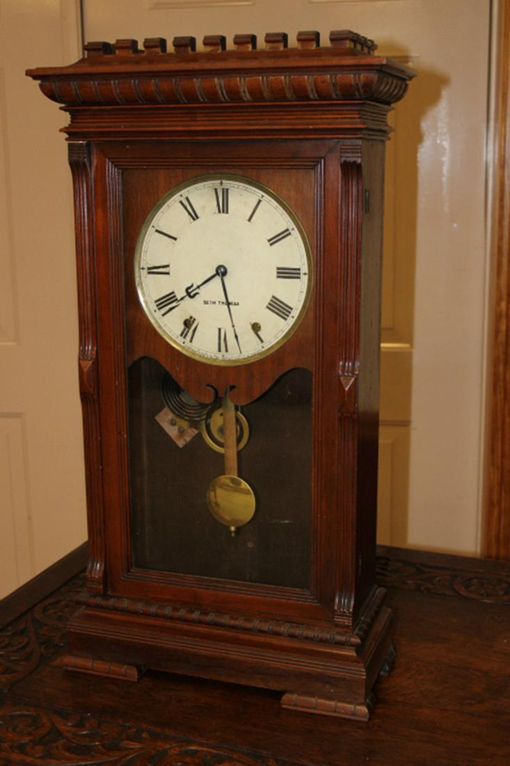 Walnut Seth Thomas "Garfield" Clock: Walnut Seth Thomas "Garfield" clock. Nice original finish on the case, replaced pendulum. 16" wide, 29" tall, 7" deep.