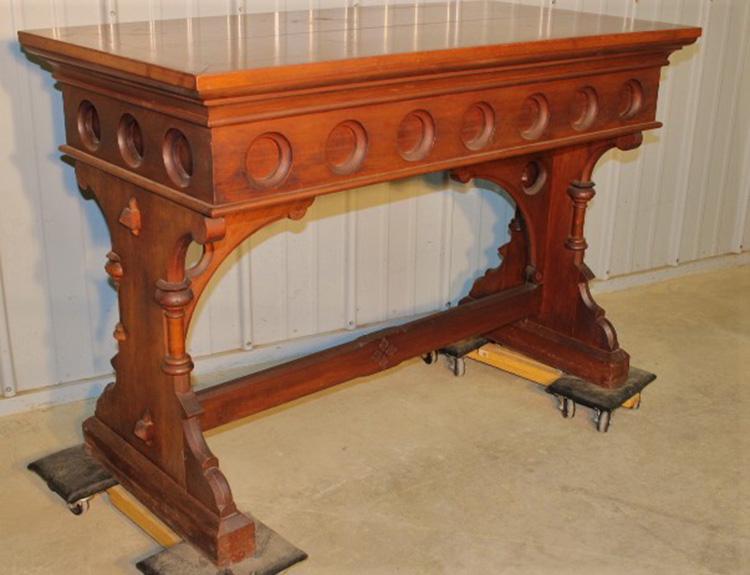 Walnut Gothic Library Table: Nice walnut gothic library table with keyed tenons and stretcher. Couple of rings on the top. 48" wide, 33" tall, 24" deep.