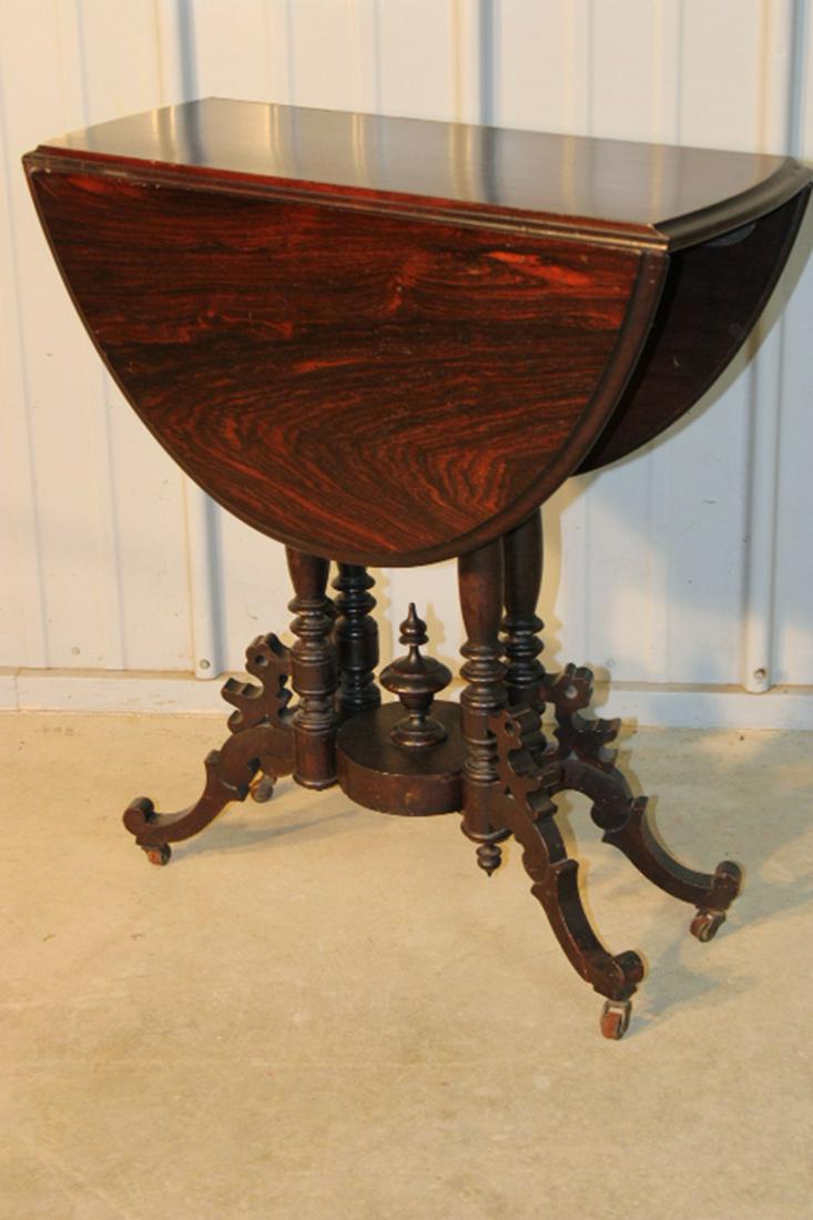 Sweet Victorian Rosewood Drop Leaf Table: Sweet Victorian rosewood drop leaf table with fancy rotary base. 26" wide, 29" tall, 36" deep.