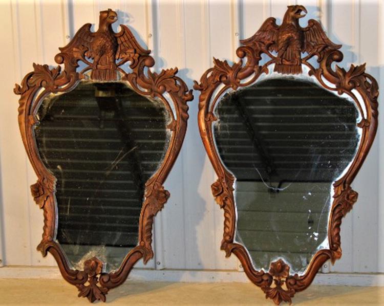 Pair of Fancy Wooden Mirrors with Eagle Crest: Pair of fancy wooden mirrors with carved eagle crest. Probably about 40-50 years old. 25" wide, 40" tall.