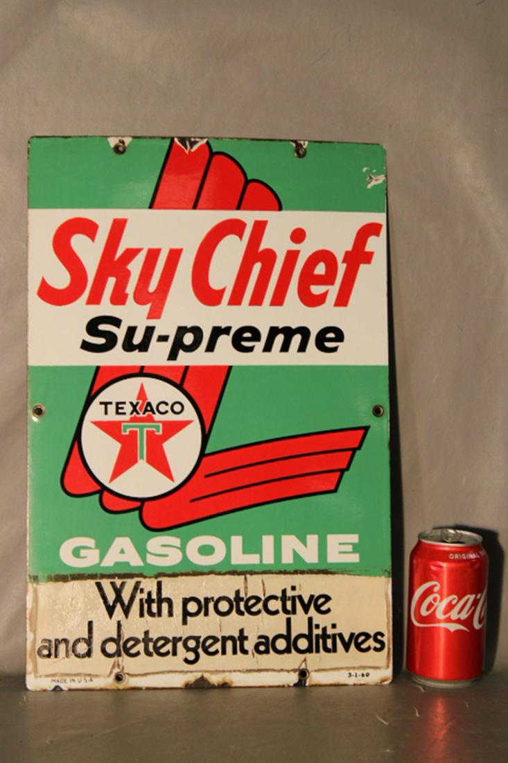 1960 Porcelain Texaco Sky Chief Sign: 1960 porcelain Texaco Sky Chief sign with some chipping around the edge. Years ago someone put a sticker over the bottom portion (original advertising under it) can easily be taken off. 12" wide, 18"