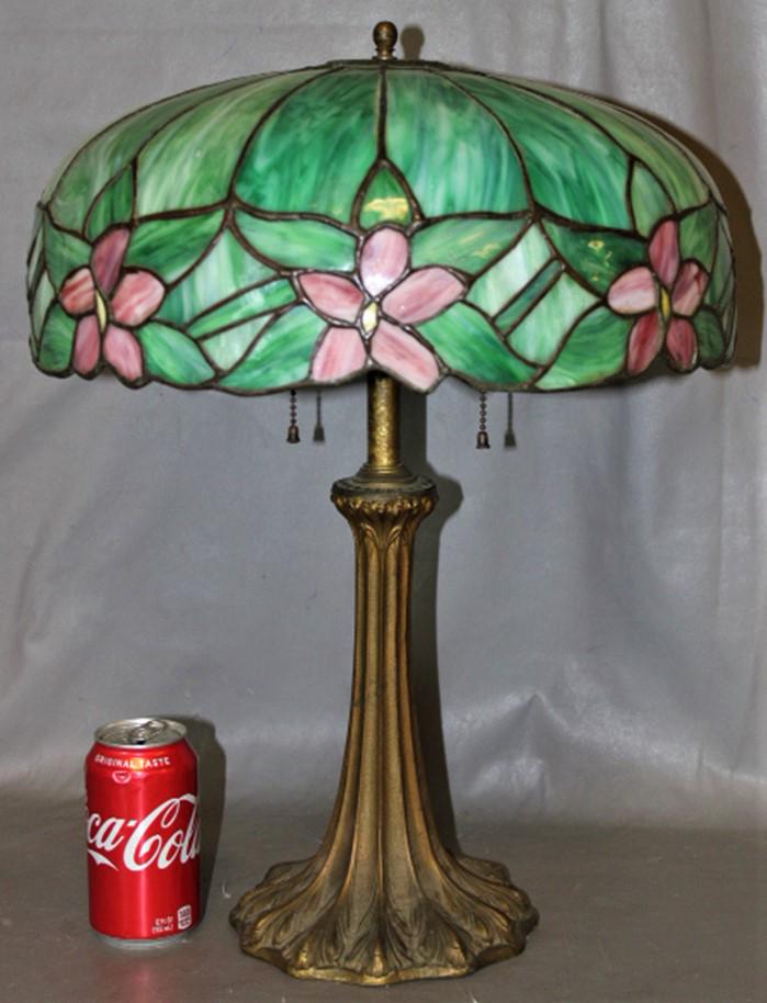 Antique Leaded 16" Poinsettia Table Lamp: Antique leaded 16" Poinsettia table lamp. Couple of small lines, pretty lamp. 16" wide, 21" tall.