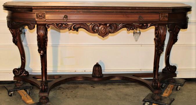 Fancy Flip Top Console Table: Fancy flip top console table, has fancy stretcher base and carved legs. Nice overall condition, couple of rubs. Opens to 66" wide and 44" deep. 66" wide, 32" tall, 22" deep.