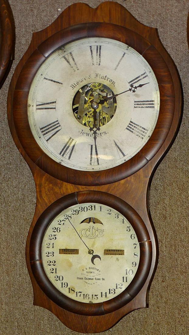Ithaca "Horton's" Patent Double Dial Calendar Clock: Ithaca "Horton's" patent double dial calendar clock "with advertising" Moser & Flatron Jewelers in rosewood. 15" wide, 29" tall, 5" deep.