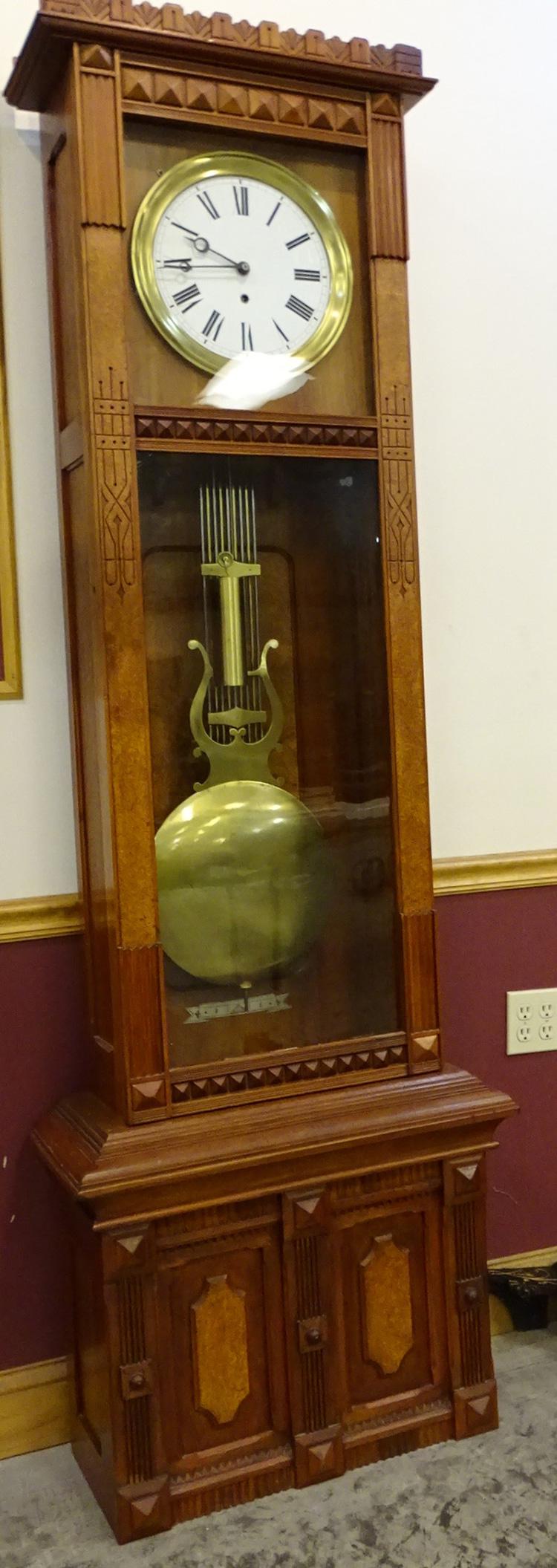 7' Weight Driven Gilbert Jewelers Regulator Clock: 7' weight driven Gilbert Jewelers regulator clock in original finish. Has the calendar, the date section is inside but tattered. 17" wide, 42" tall, 8" deep.