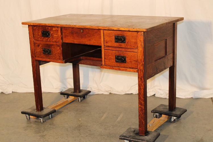 Signed Gustav Stickley Desk: Signed Gustav Stickley desk with original hardware, red compass mark and paper label. Couple of stains on top. 42" wide, 29" tall, 24" deep.