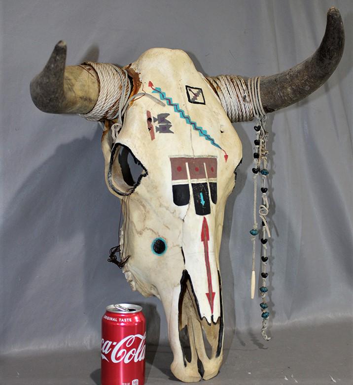 Neat Animal Skull with Indian Design Paint: Neat animal skull with Indian design paint. Old with attached horns. 20" wide, 22" tall, 15" deep.