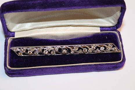 Great Ladies White Gold Diamond Bar Pin: Great ladies white gold diamond bar pin with 23 Rd cut diamonds totally 1.15 carats. Total weight 4 DWT, 3 1/4" long.