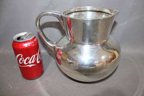 Heavy 40 Troy Oz Sterling Silver Water Pitcher: Heavy 40 troy oz sterling silver water pitcher signed 925 Ortega. Has a small ding on the side (see photo). No monograms.