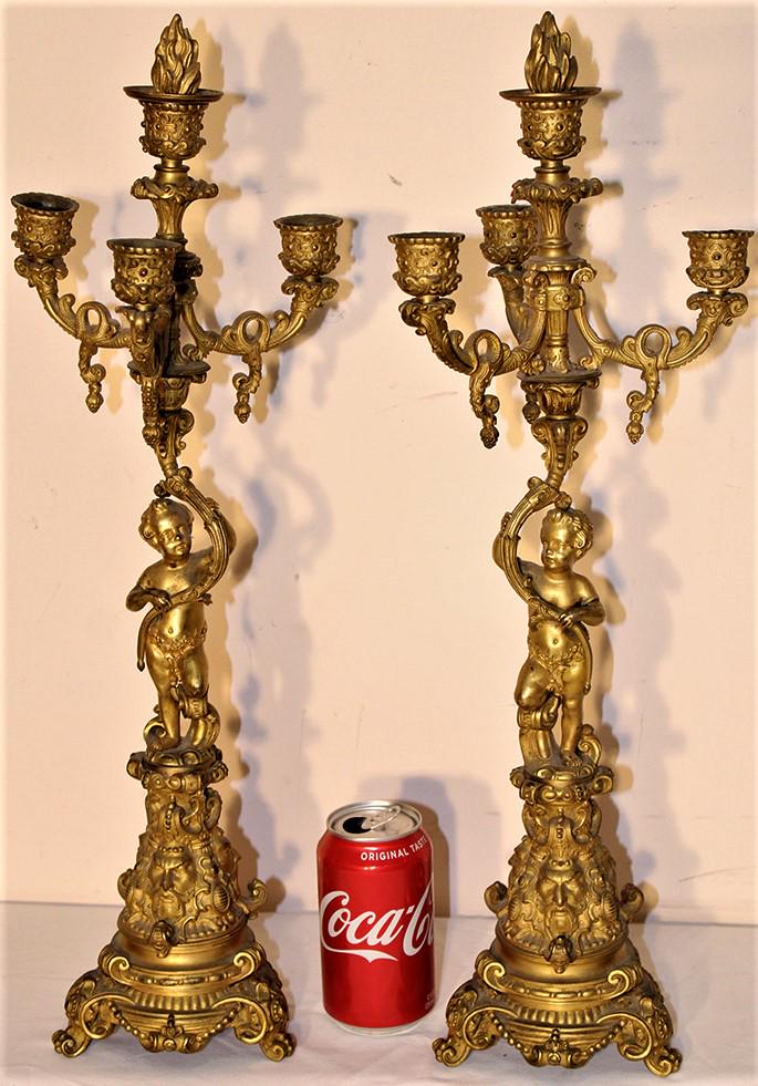 Pair of 22" Bronze Candelabras with Northwind Faces and: Pair of 22" bronze candelabras with Northwind faces and putties. Dore finish in very nice condition.