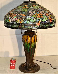 Huge Beautiful Tiffany Style Leaded Lamp with Solid: Huge beautiful Tiffany style leaded lamp with solid bronze base, Very heavy and colorful. Not antique but nice. 22" wide, 31" tall.