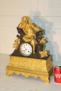 Large Early French 2 Tone Bronze Figural Clock with: Large early French 2 tone bronze figural clock with a Dore bronze finish. Porcelain face, springs are good. 14" wide, 19" tall, 5" deep.