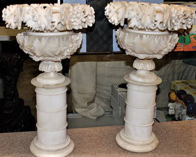 Pair of Great 22" Victorian Carved Marble Urns with: Pair of great 22" Victorian carved marble urns with round bases. Couple of very small chips, otherwise very nice. 13" wide, 22" tall.