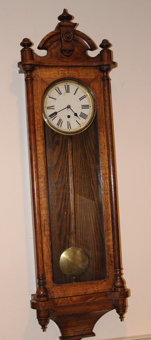 Large Oak 51" Waterbury "Nelson" Wall Regulator Clock: Large oak 51" Waterbury "Nelson" wall regulator clock. Springs all good, looks to be in nice condition. 15" wide, 51" tall, 6" deep.