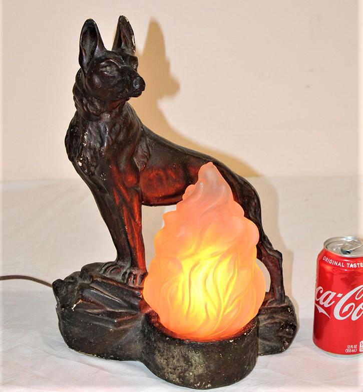 Great Antique Lamp With German Shepherd And Flame Shade: Great antique lamp with German Shepherd and flame shade. In nice condition, a few rubs on edge but overall beautiful lamp. Small flea bites on shade (see photo). 11" wide, 15" tall, 6" deep.